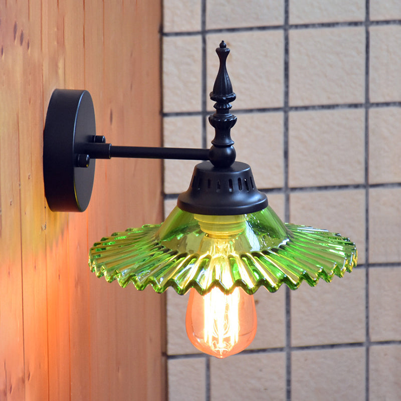 Light Up Your Space with Industrial Chic: The 1-Light Black Sconce with Clear/Green Glass