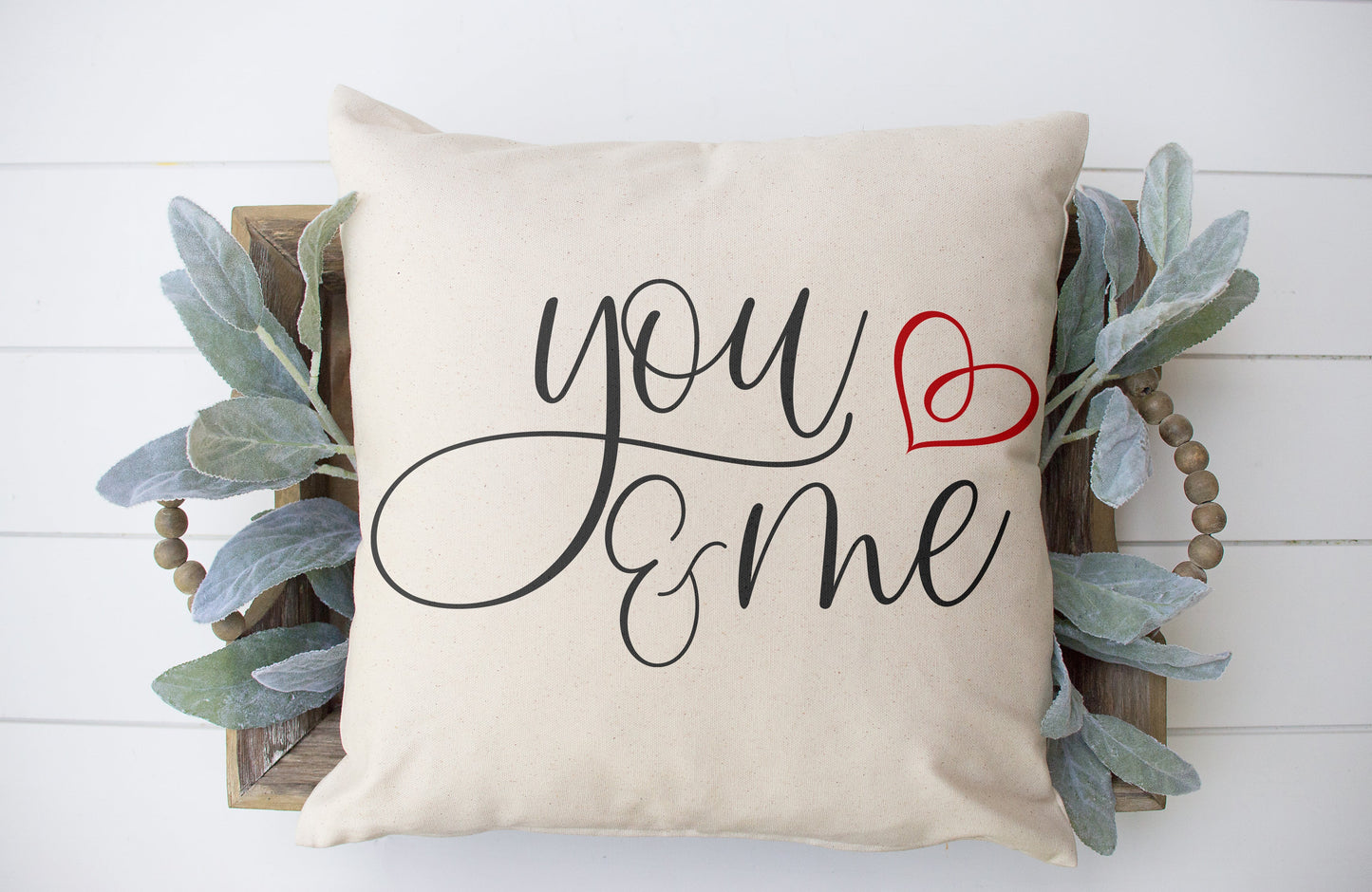 You and Me 18x18 inch Pillow Cover with stylish script writing and a red heart accent on an oatmeal background.