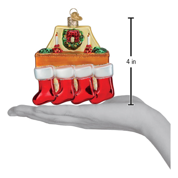 Family Of 4 Stockings Ornament displayed in hand, highlighting festive holiday design and size of 4 inches.