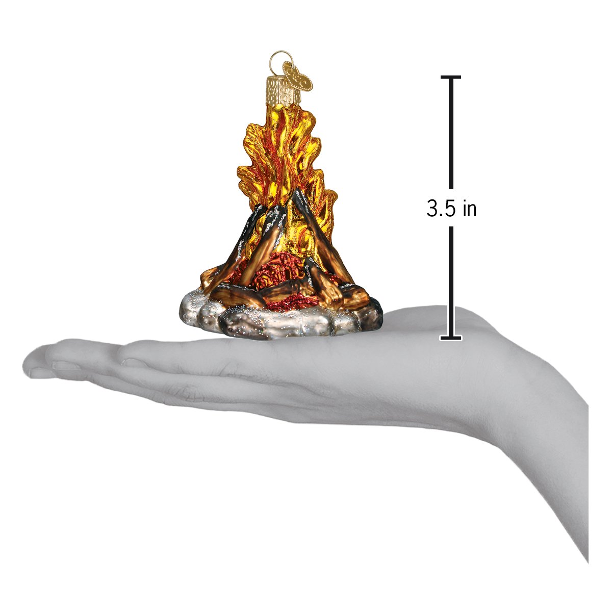 Glass ornament of a campfire with measurement on a hand
