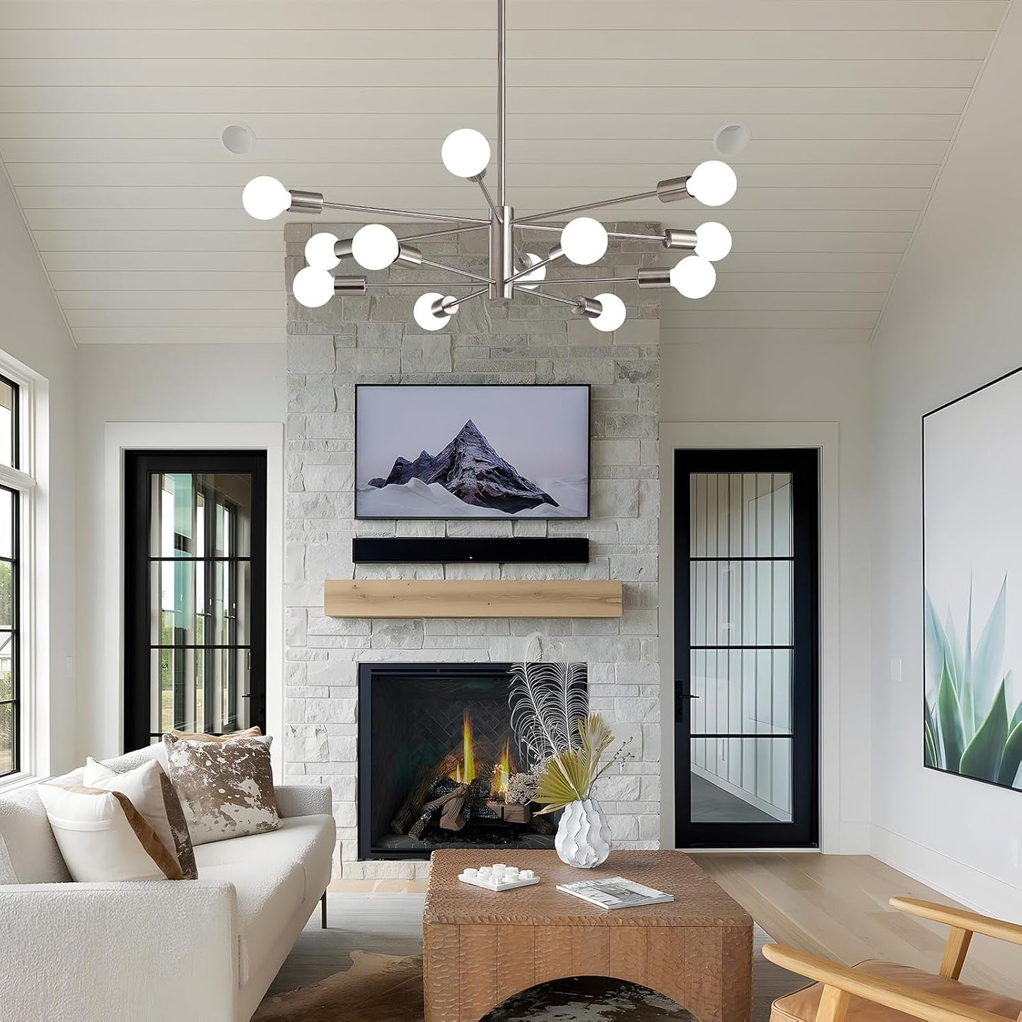 Sputnik 12 Light Brushed Nickel Chandelier For Dining Room illuminating a modern living space with a cozy fireplace.