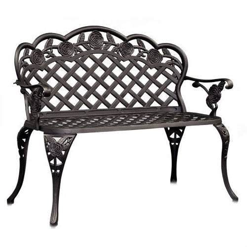 Decorative black metal bench with rose designs on a white background