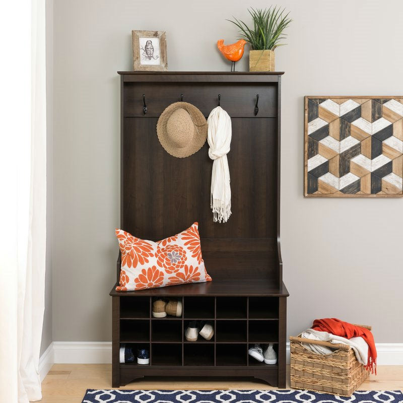 Dark Brown Entryway Hall Tree Shoe Cubby Coat Rack with hooks, storage cubby, and decorative items.