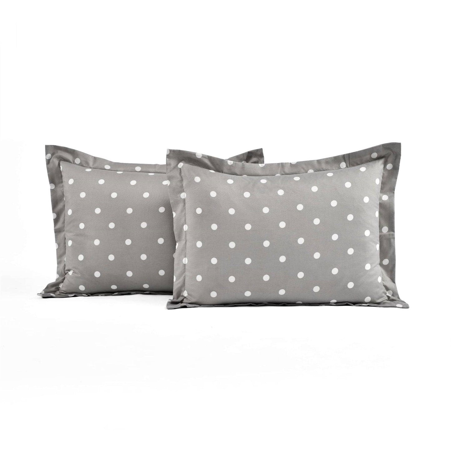 Two gray pillows with white polka dots on a white background