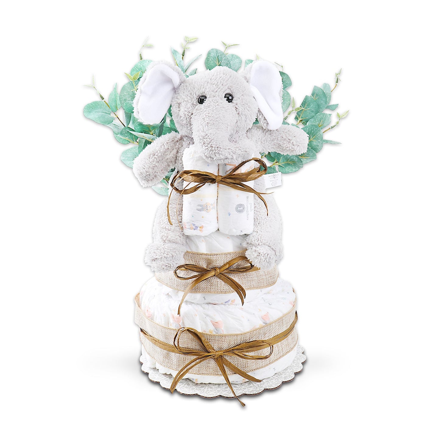 Decorative diaper cake with plush toy and greenery on a white background