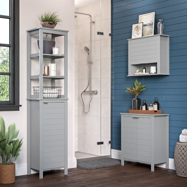 Gray bathroom cabinets with shelves and decorative items in a modern bathroom setting.