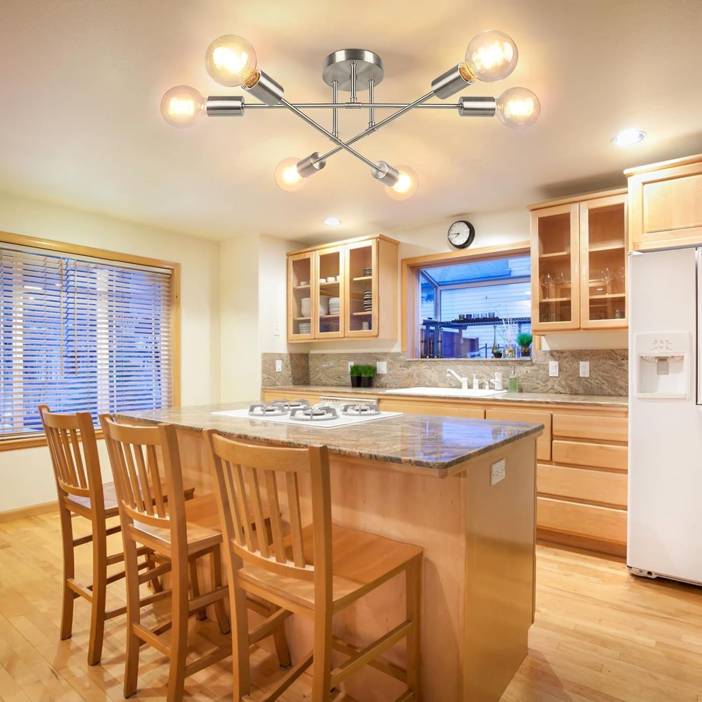 Six Light Sputnik Chandelier Brushed Nickel Fixture illuminating a modern kitchen with wooden cabinets and bar stools.