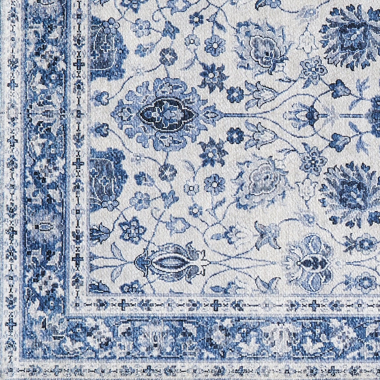 Blue and white floral patterned rug with intricate designs
