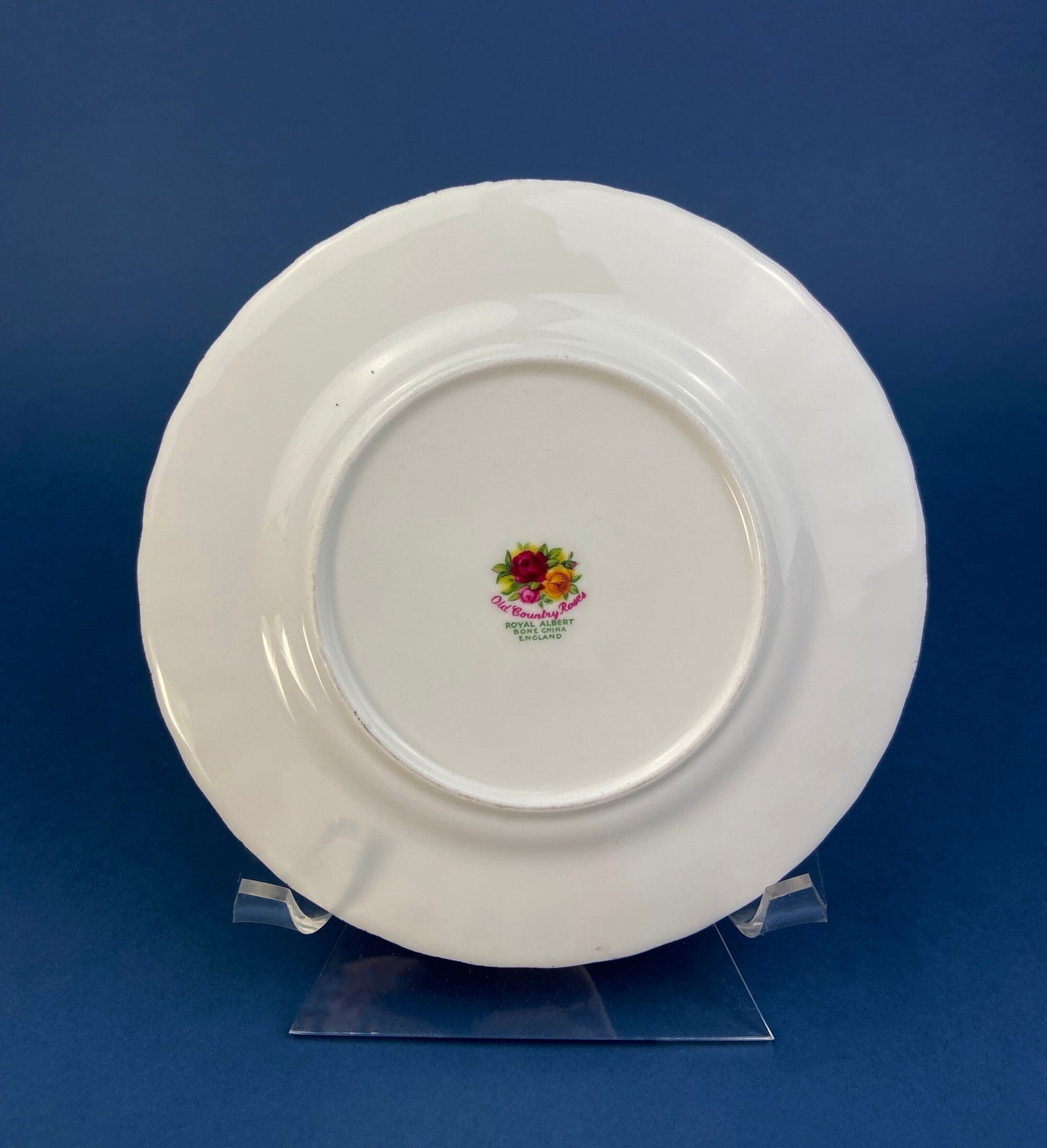 White plate with a colorful logo on a blue background