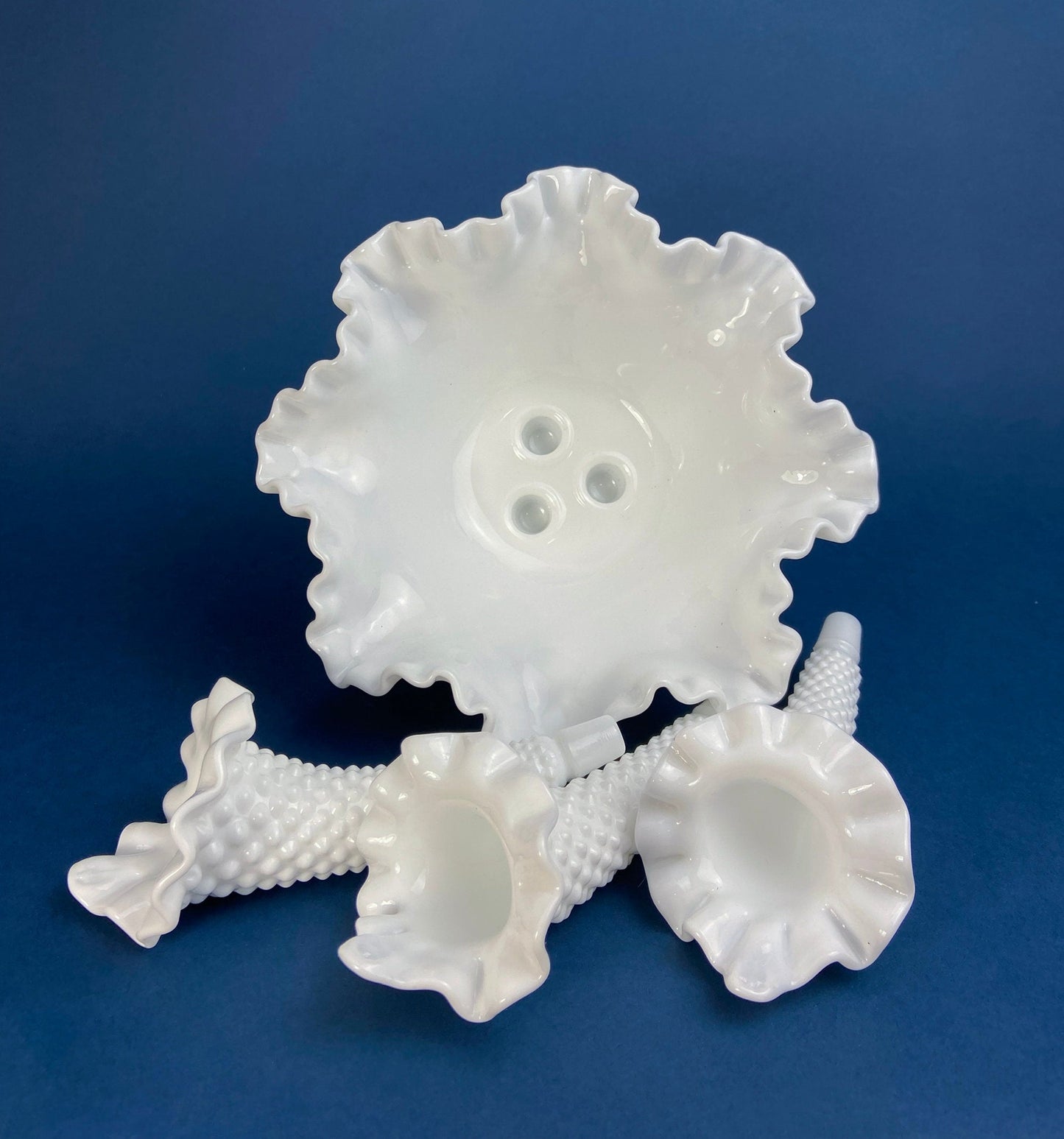 White ceramic coral sculpture on a blue background