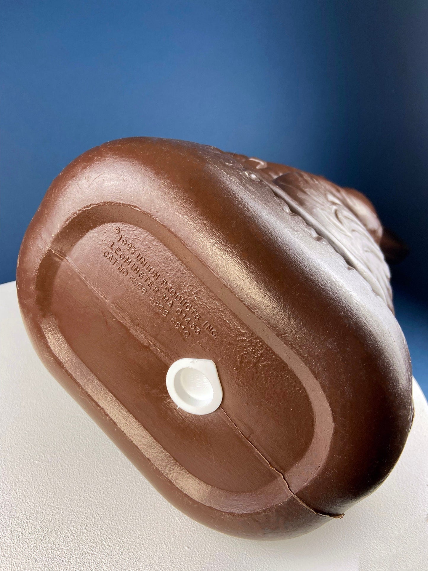 Close-up of a chocolate bunny with a blue background