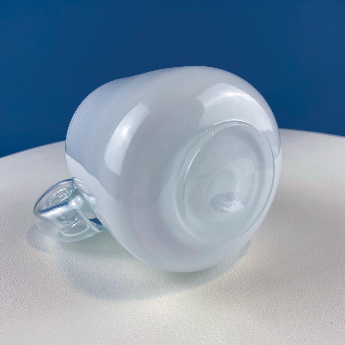 Clear glass container with a blue background