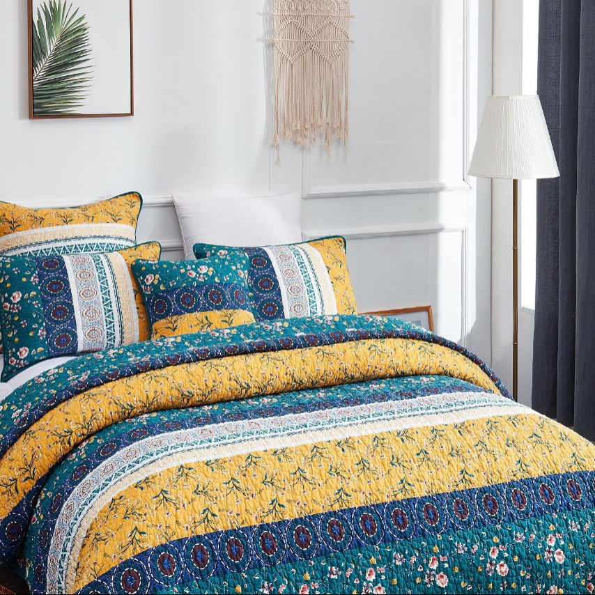 Boho Bedroom with vibrant floral bedding, decorative pillows, and cozy decor in a bright, inviting setting.