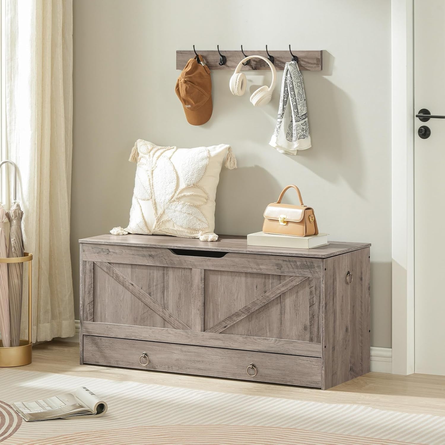 Coat Hooks displayed above a wooden storage bench with decorative pillows and accessories.