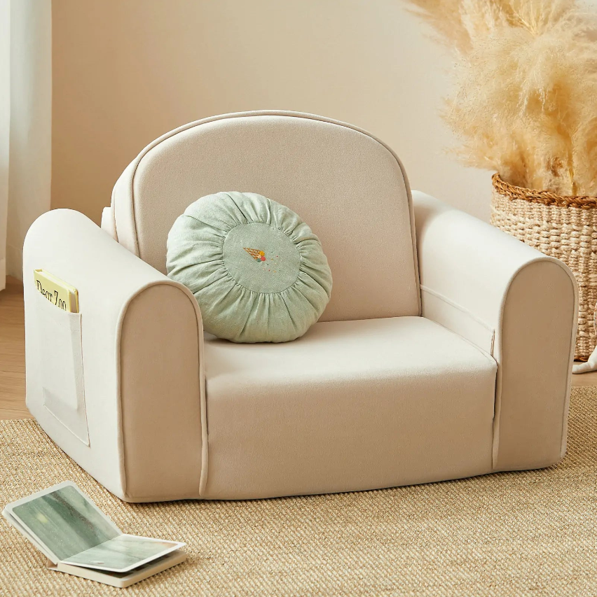 Kids' Chairs in a cozy room featuring a beige soft chair with a round cushion.