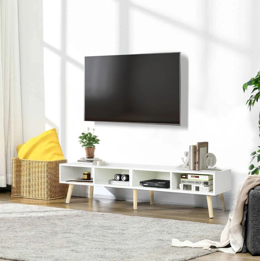A beautiful setup in a Minimalist Living Room featuring a white TV stand and ample natural light.