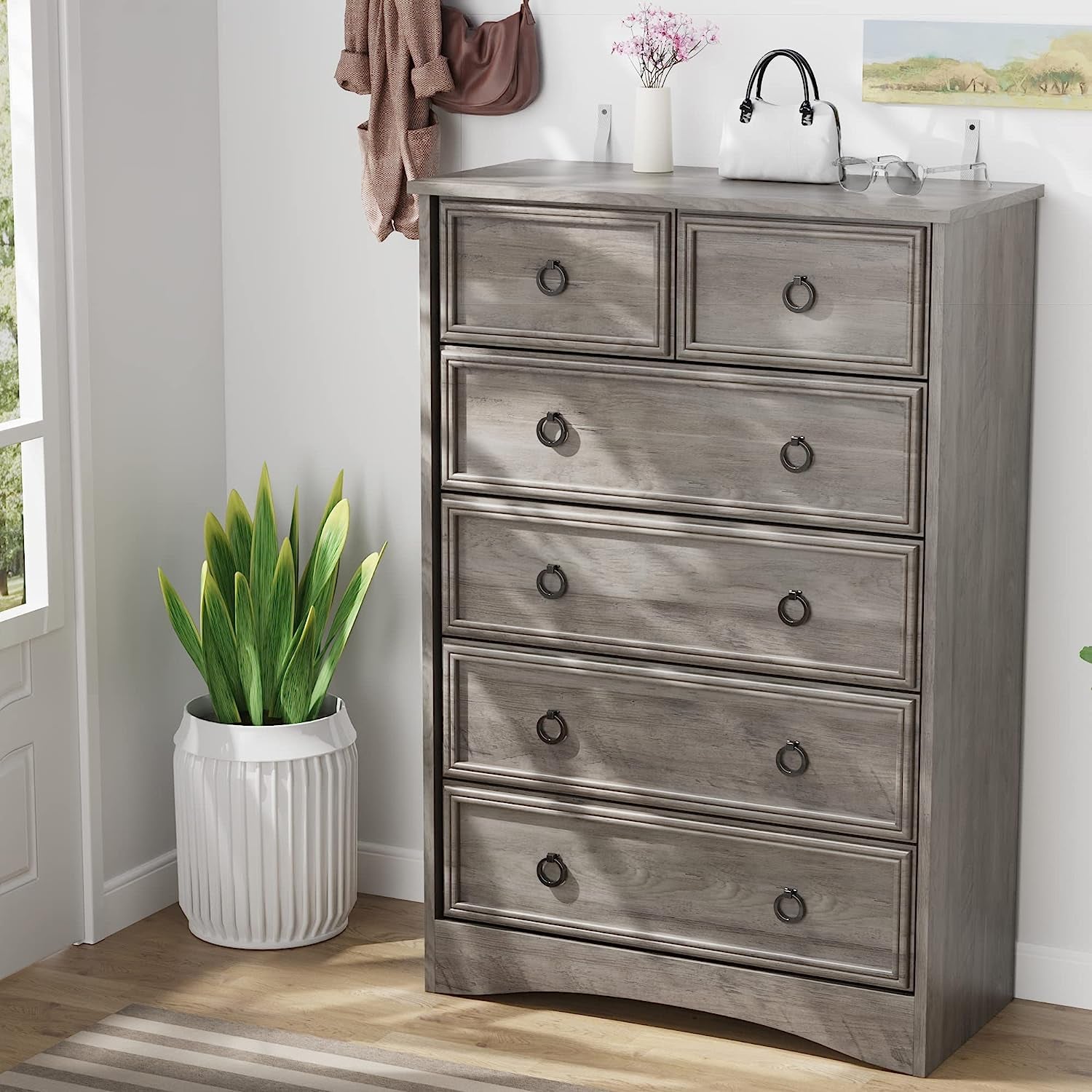 Vertical Dressers with a modern design, featuring six drawers and a sleek finish in a bright room.