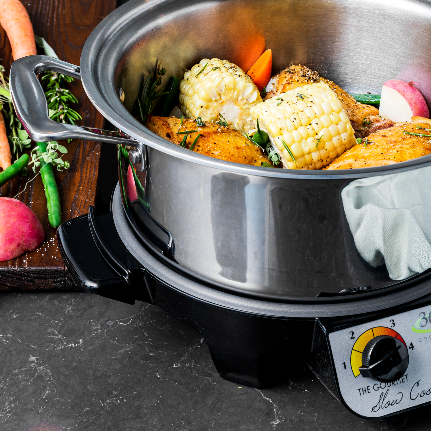 A close-up of a gourmet Slow Cooker with vegetables and chicken inside, showcasing a delicious meal preparation.