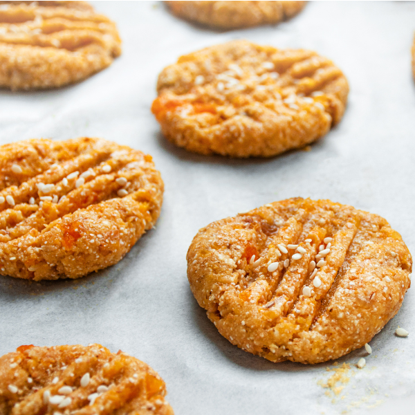 Freshly baked cookies on cookie sheets ready for cooling, showcasing the delicious texture and golden color.