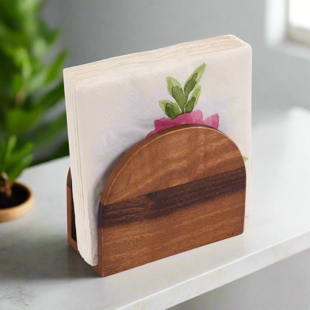 Stylish wooden napkin holder displaying floral napkins in a modern kitchen setting.