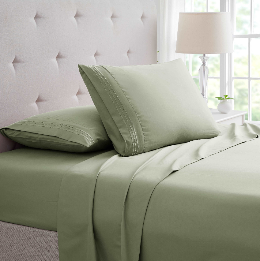 Twin and Twin XL Bed Sheets in soft green color, featuring elegant pillowcases and bedding on a cozy bed.