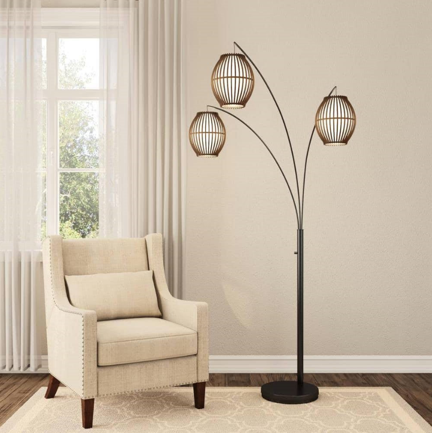 Mid-Century Modern Nursery featuring a stylish armchair and a unique arc floor lamp with three lanterns.