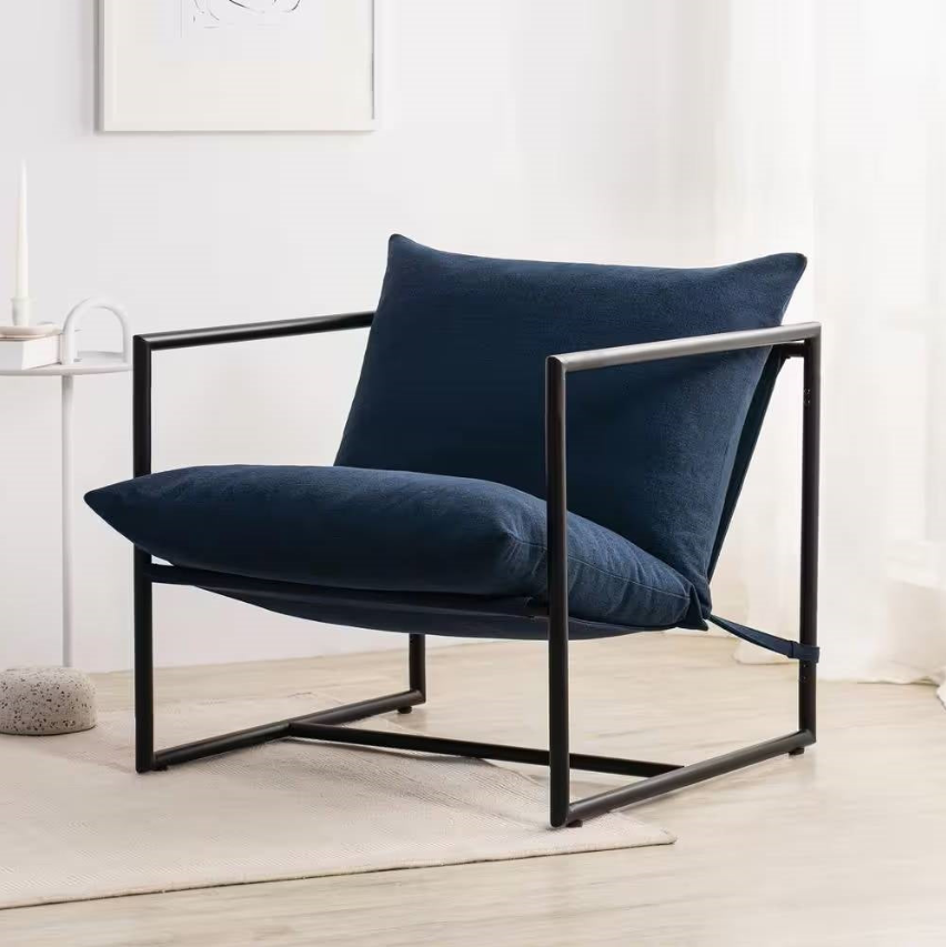 Contemporary Living Room featuring a stylish navy chair with a modern metal frame.