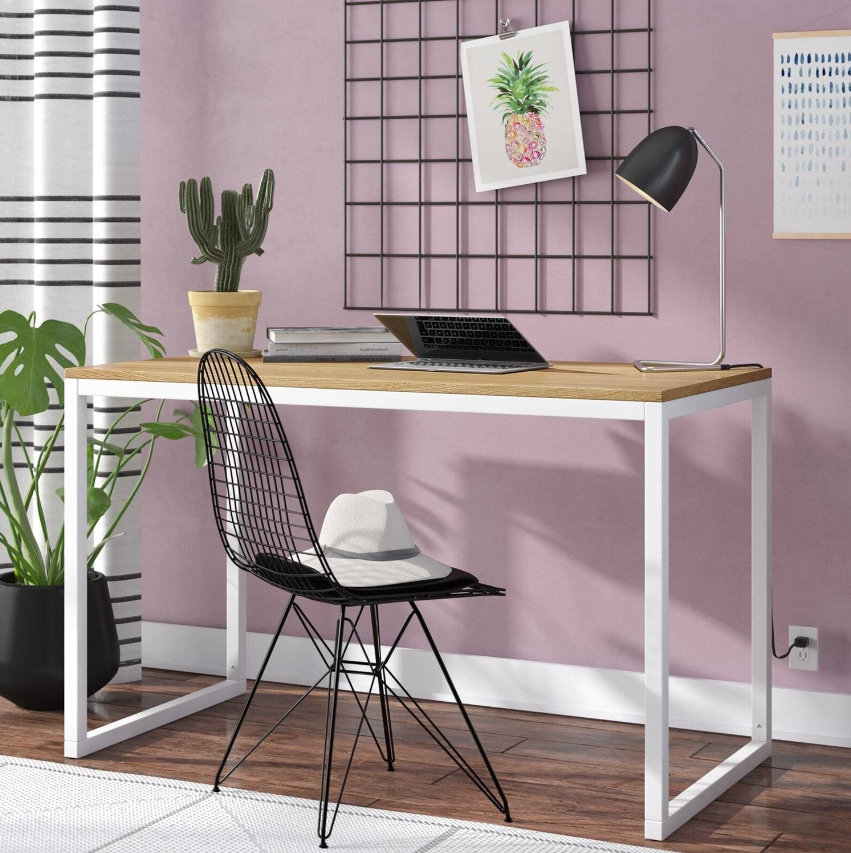Minimalist Home Office featuring a simple desk, stylish chair, and decorative wall art in a serene setting.