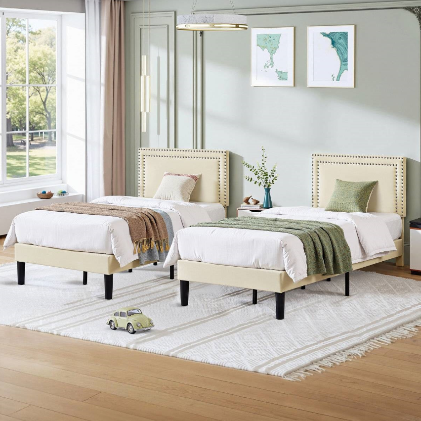 A stylish and airy Minimalist Kids' Bedroom featuring twin beds, soft bedding, and natural light.