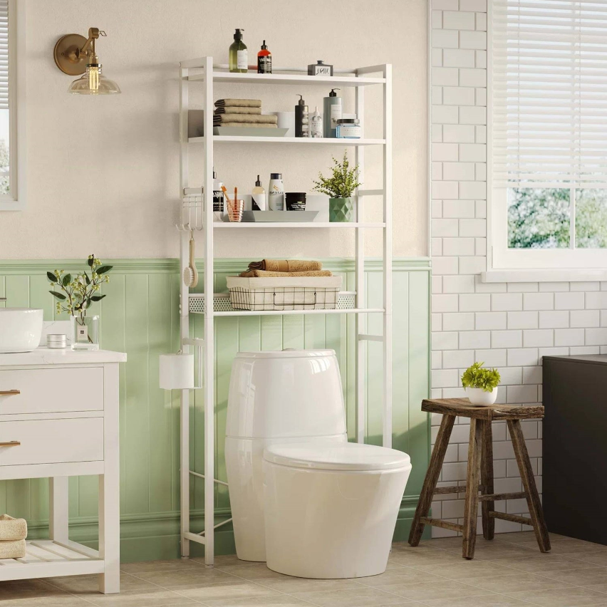 Minimalist Bathroom featuring a white shelving unit, modern toilet, and green accent wall.