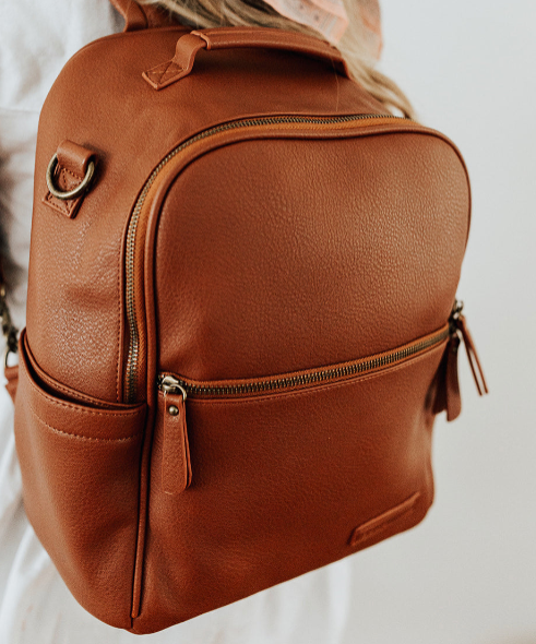 Stylish brown leather Diaper Bags with multiple compartments for easy organization.