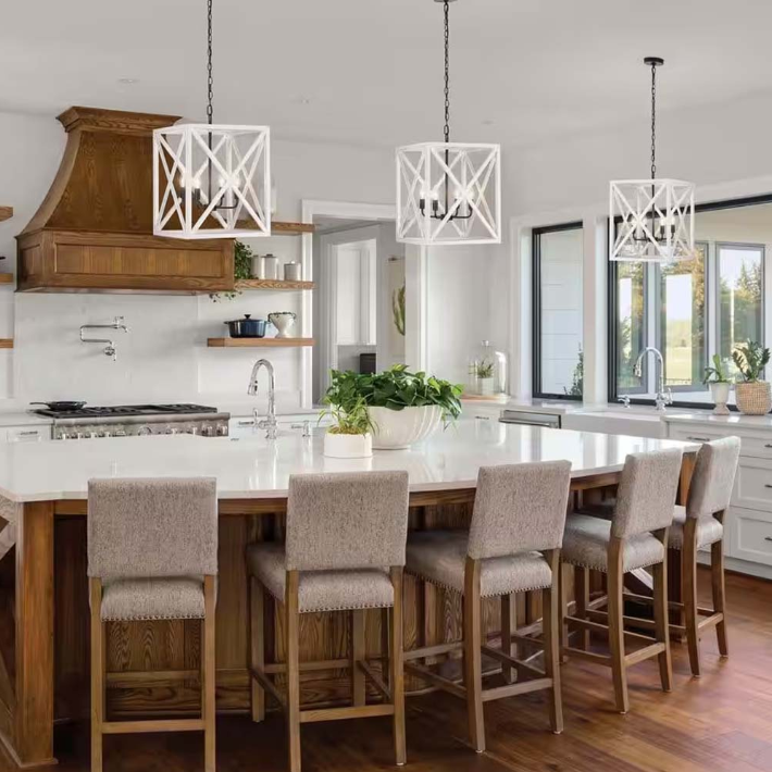 A beautiful French Country Kitchen featuring a modern island, stylish lighting, and natural wood accents.
