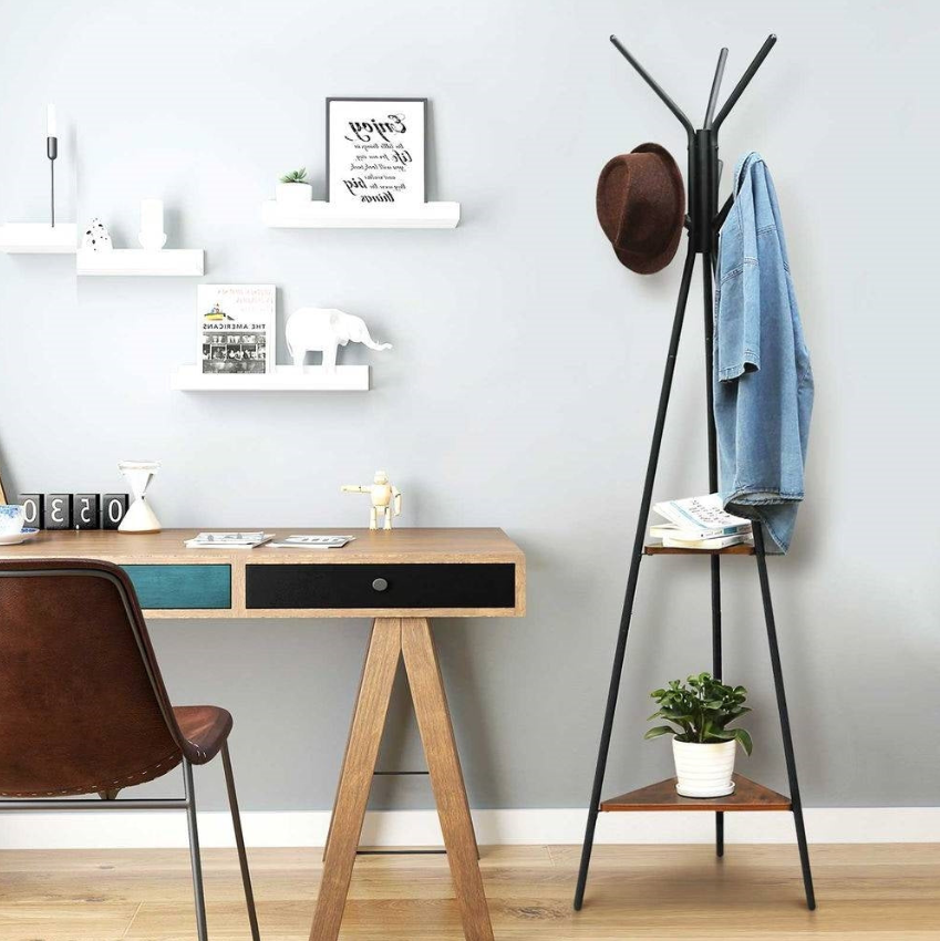 Modern Home Office featuring a stylish desk, coat rack, and minimalist decor, perfect for a contemporary workspace.