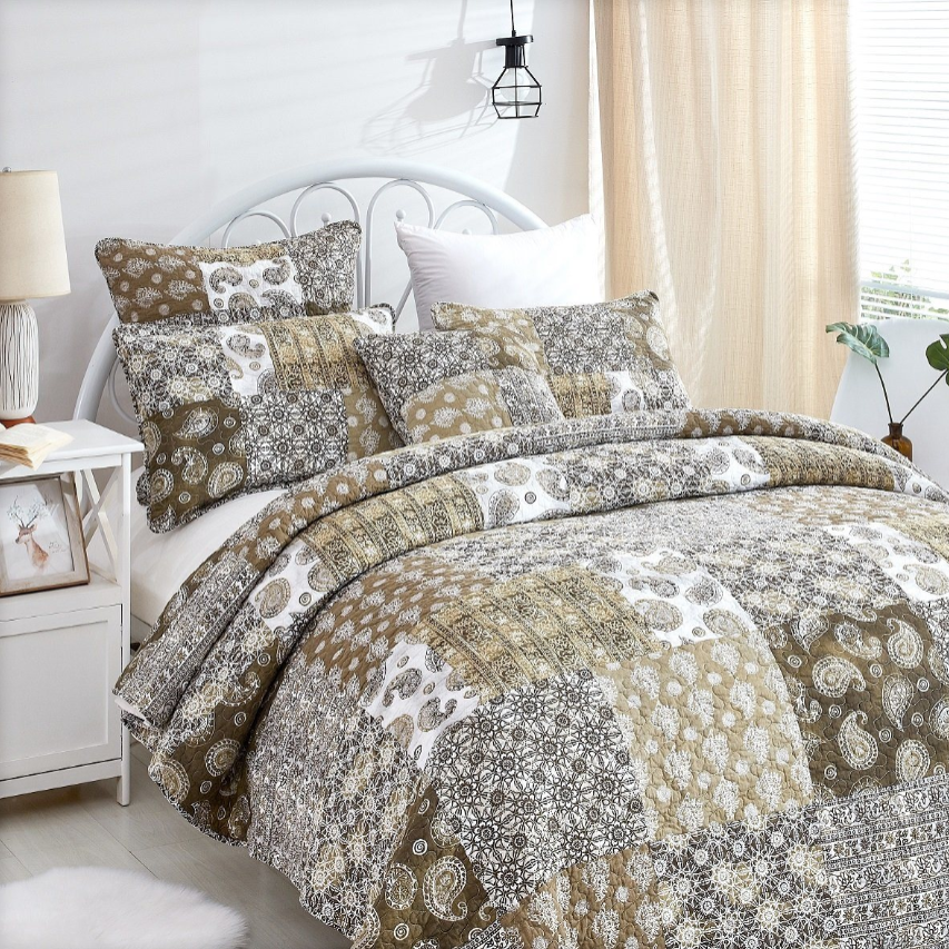 Boho Kids' Bedroom bedding set featuring a quilt and decorative pillows in earthy tones and patterns.