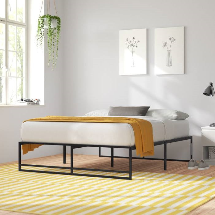 Minimalist Bedroom featuring simple bed design with yellow accents and modern decor.