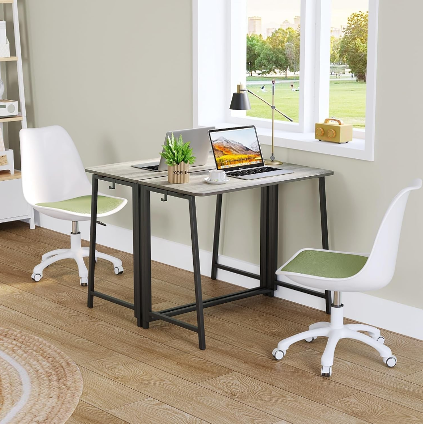Stylish Folding Desks setup with modern chairs and laptop, perfect for home office or study.