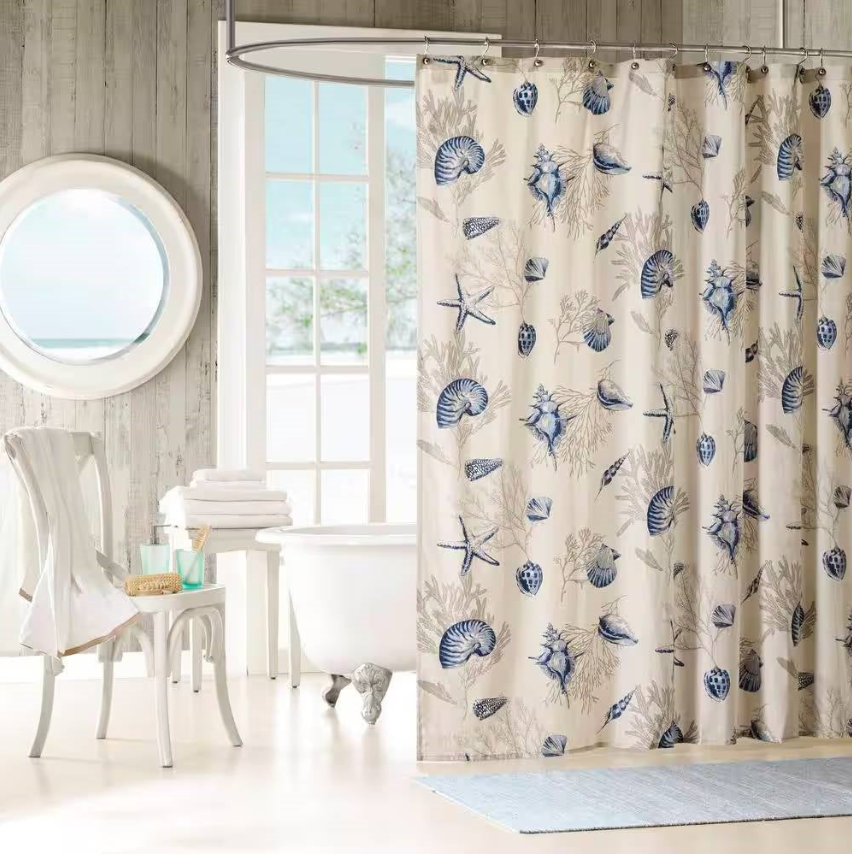 Coastal Bathroom shower curtain with seashell and starfish designs, creating a serene beach vibe in the decor.