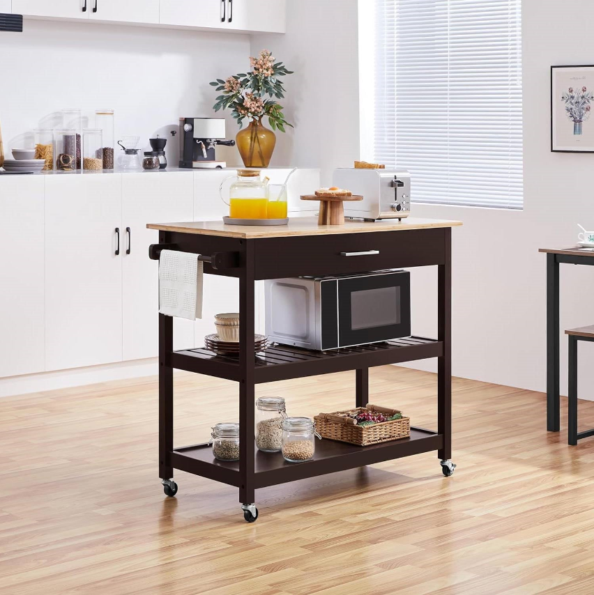 Kitchen cart in a modern kitchen, representing Mission Kitchen collection, with countertop and storage.