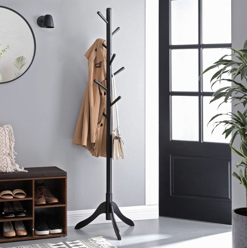 Modern Foyer with a coat rack, stylish black design in a contemporary entryway.