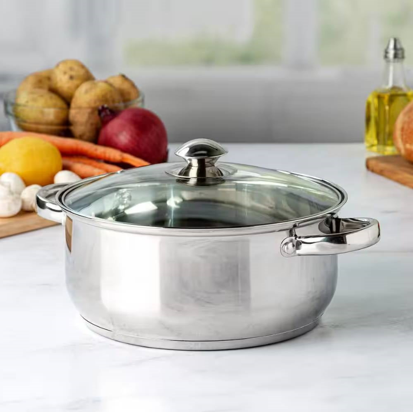 Polished stainless steel Dutch Oven with lid, perfect for preparing meals in style.