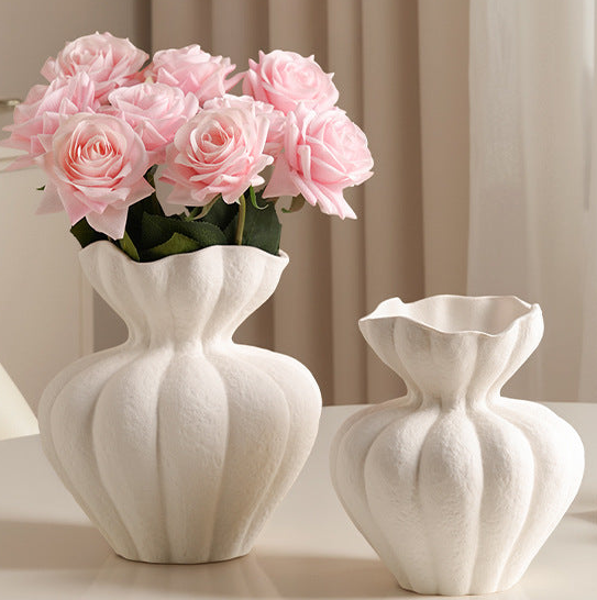 Elegant vases with pink roses, fitting for a French Country Bathroom decor style.