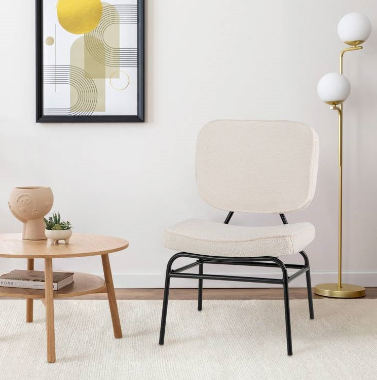 Accent Chairs in a modern living room with a stylish lamp and coffee table.