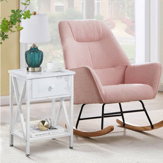 Cozy setup in a Rustic Nursery featuring a soft pink rocking chair and stylish side table with lamp.