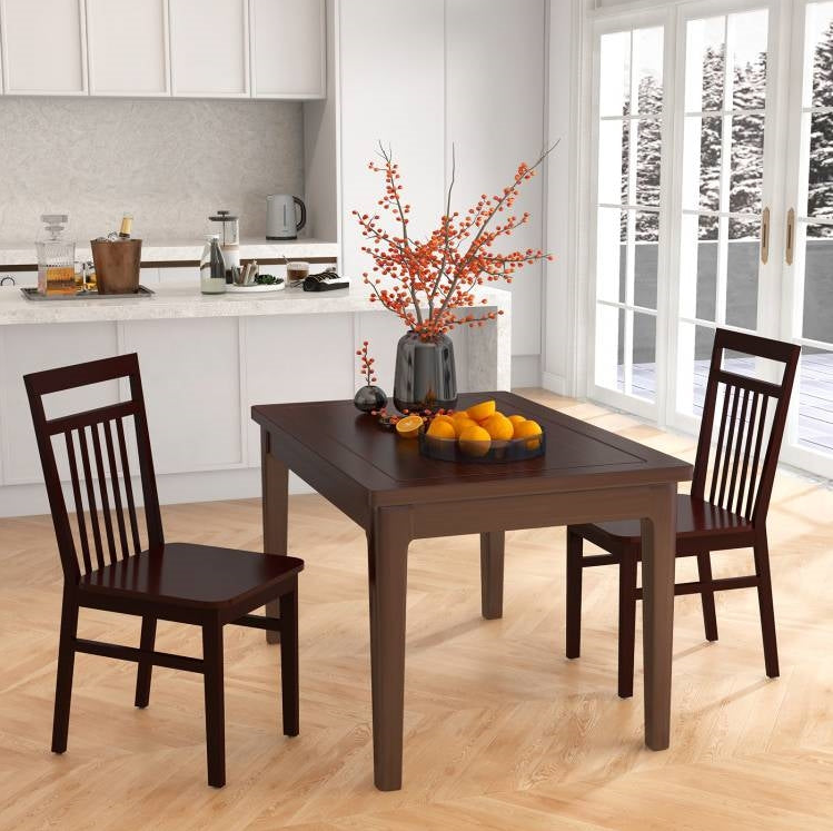 A cozy Farmhouse Kitchen featuring a wooden dining table with chairs and a centerpiece of oranges.