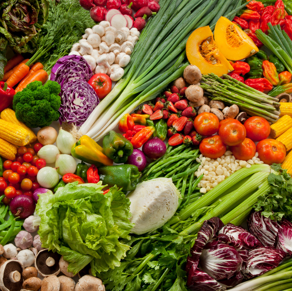 Colorful assortment of fresh vegetables and herbs, ideal for planting garden seeds.