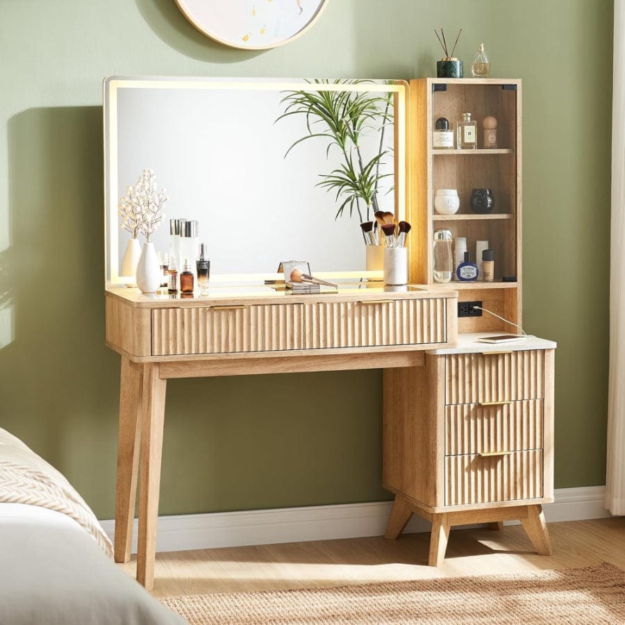 A stylish vanity table with mirror and organizer shelves for cosmetics and beauty products, showcasing elegant vanity tables.