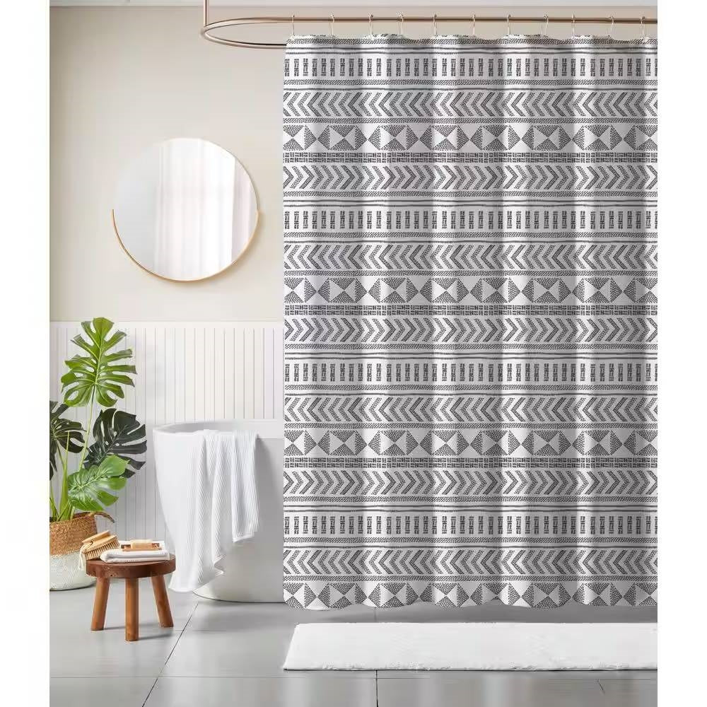 Scandinavian Bathroom featuring a patterned shower curtain with geometric designs and a modern decor.