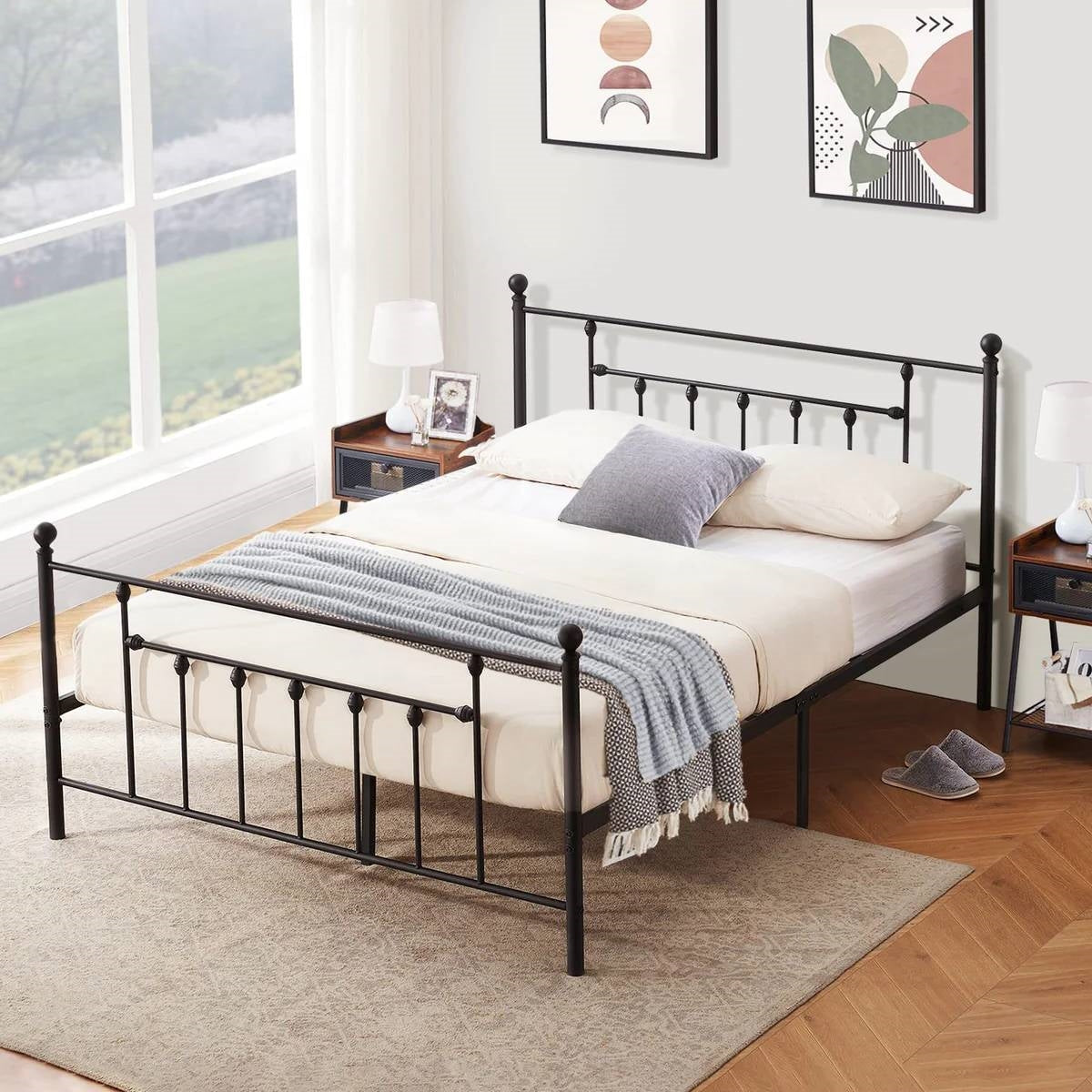 Stylish black metal Full and Queen Beds with cozy bedding in a bright room.