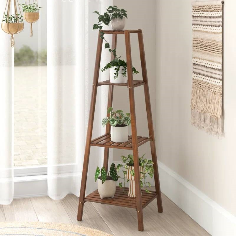 A stylish wooden plant stand with greenery, perfect for a Boho Home Office vibe.
