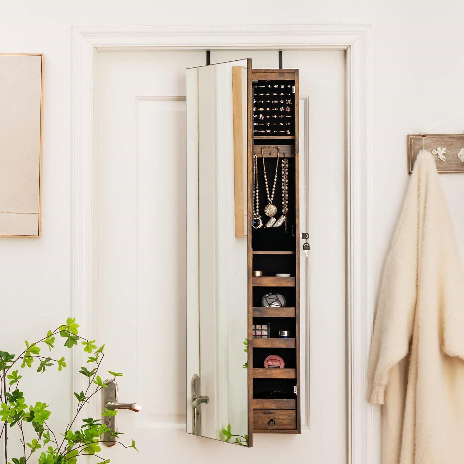 Jewelry Cabinets hanging on a door, featuring organized compartments for necklaces and rings.